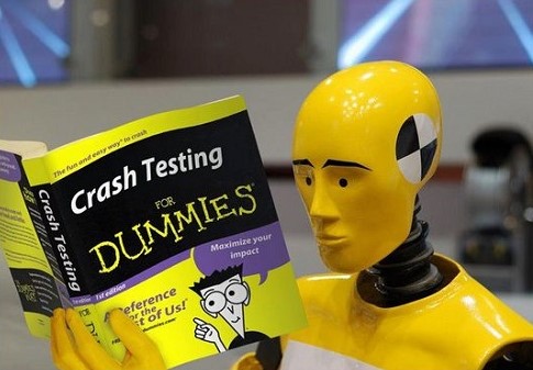 Crash test dummy reading a book about testing